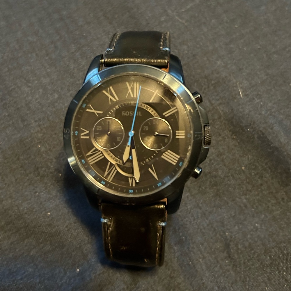 Black and blue Fossil watch